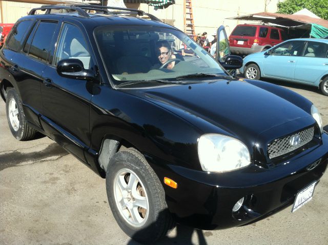 2001 HYUNDAI SANTA FE black 4 doorair conditioningamfm radioautomatic transmissioncd playerc