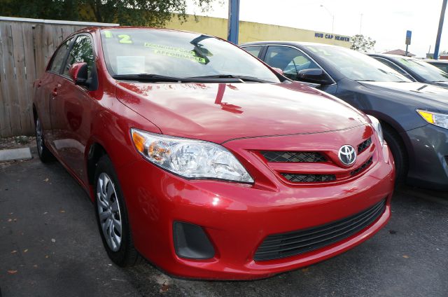 2012 TOYOTA COROLLA LE 4-SPEED AT barcelona red metallic call now 1-866-717-9571   free autocheck